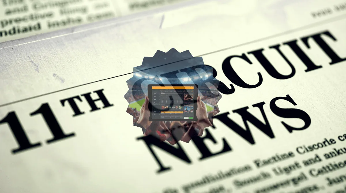 11th Circuit Sports Betting News headline featuring FanDuel/DraftKings app on a tablet device in a football stadium